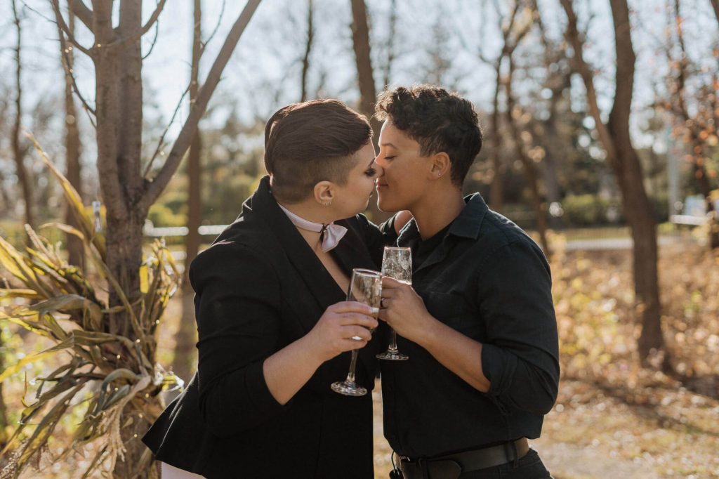 Women couple kissing after engagement